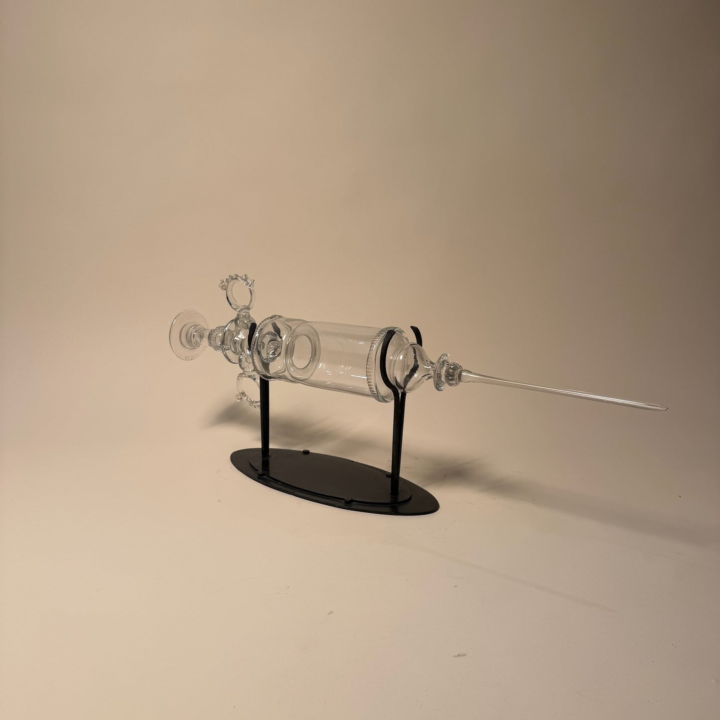 Glass Syringe on Metal Stand by Andy Paiko