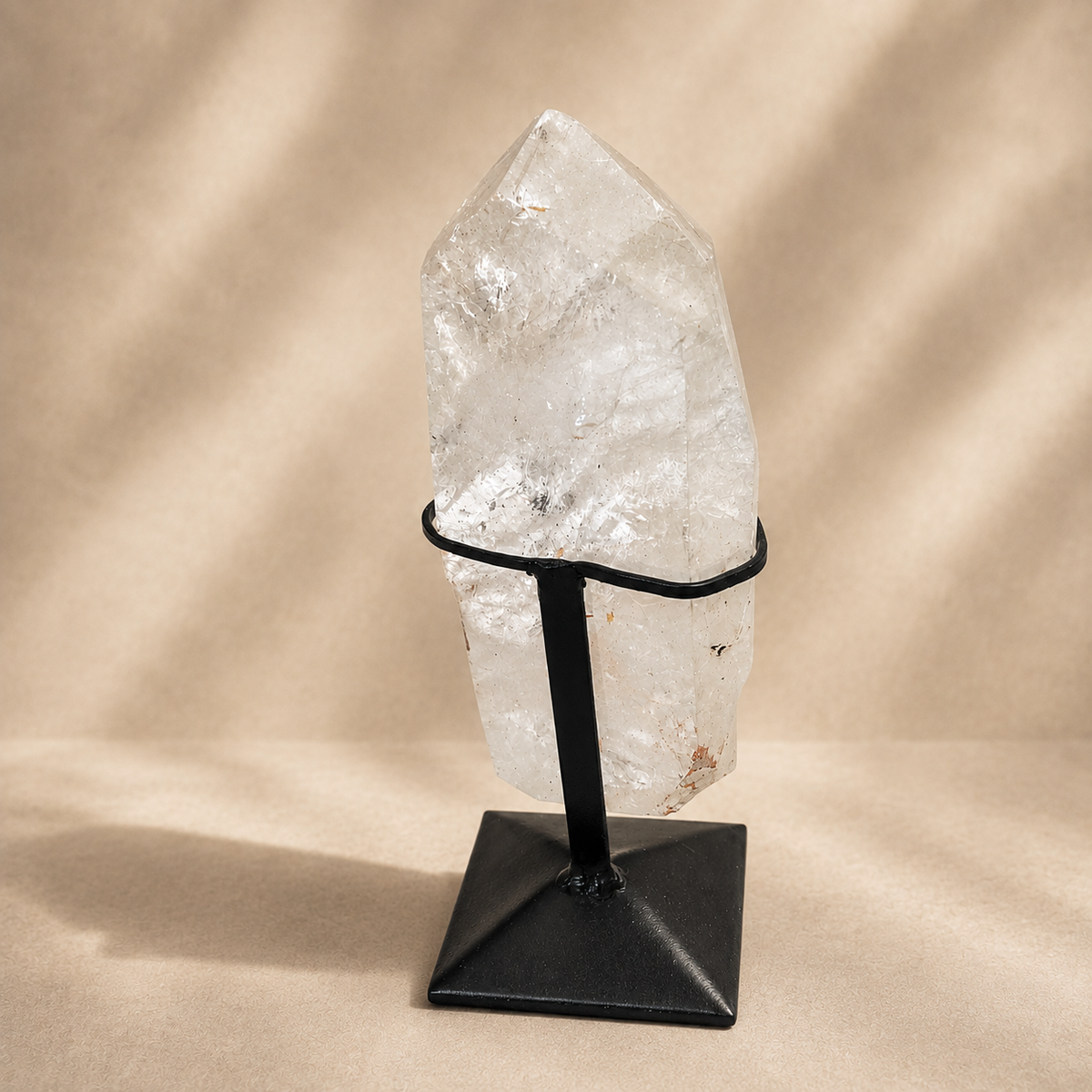 Quartz Crystal Generator on Black Metal Stand