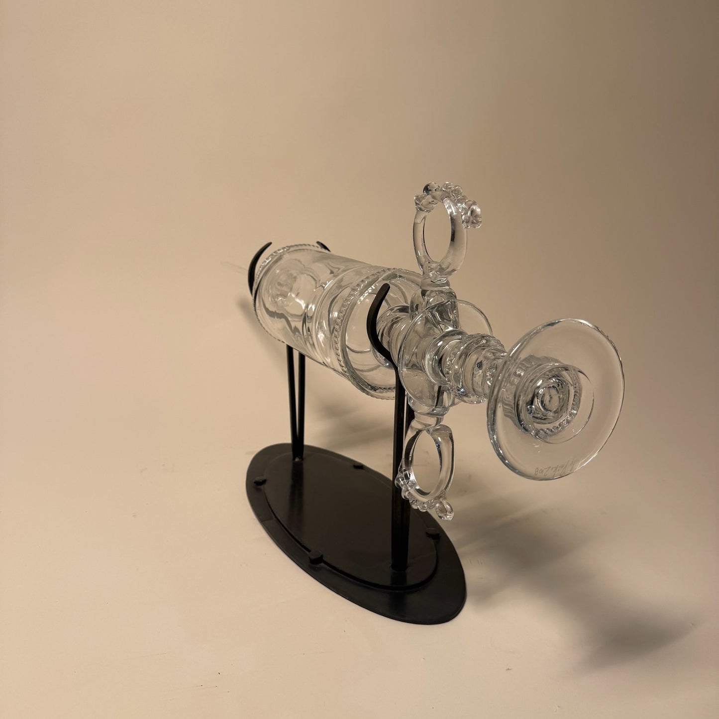 Glass Syringe on Metal Stand by Andy Paiko