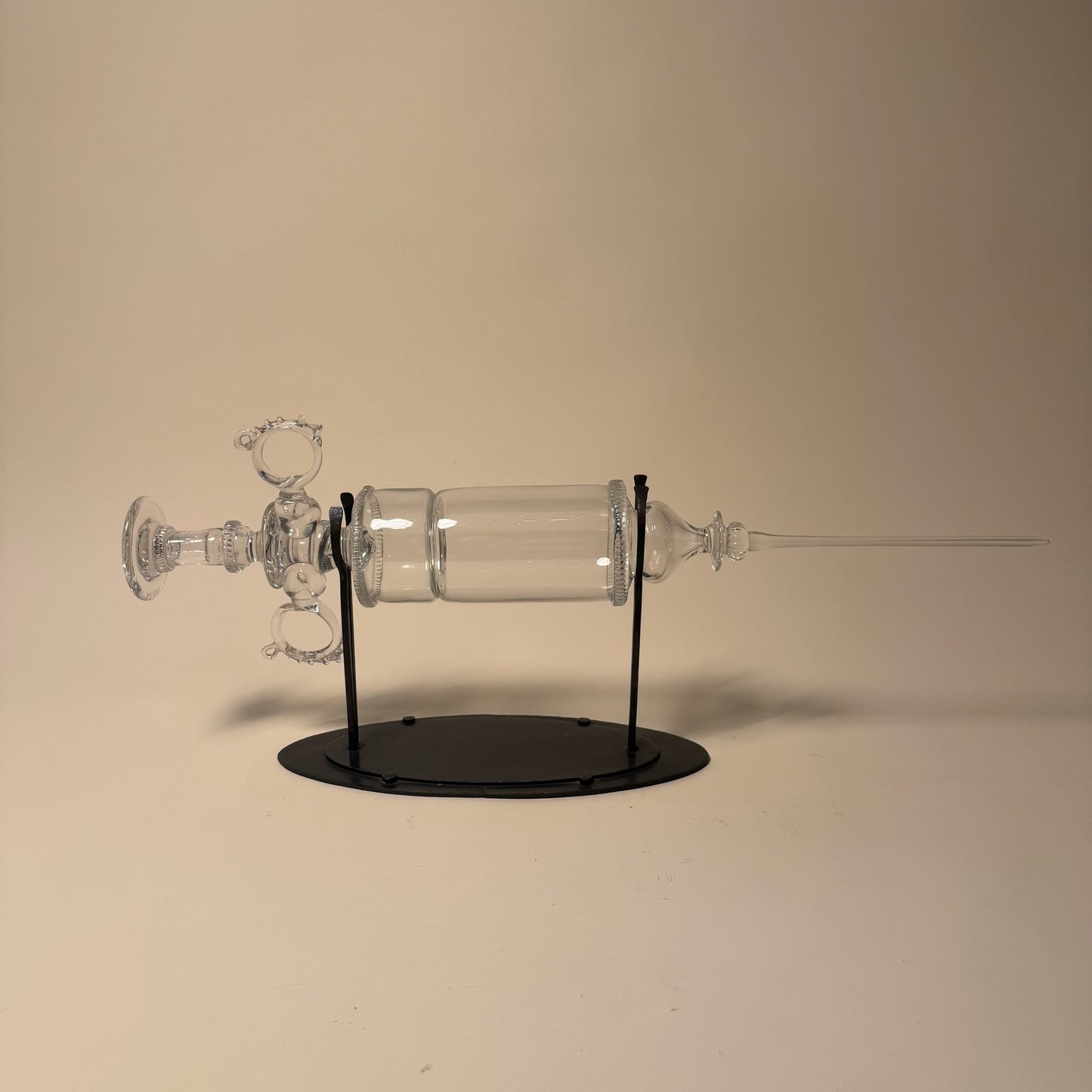 Glass Syringe on Metal Stand by Andy Paiko