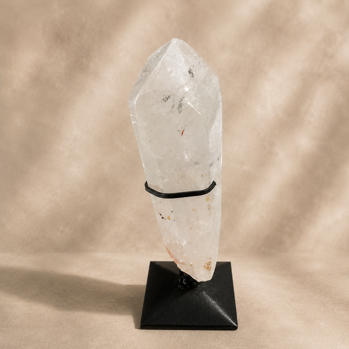 Quartz Crystal Generator on Black Metal Stand